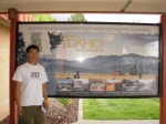 standing by the welcome to Idaho sign